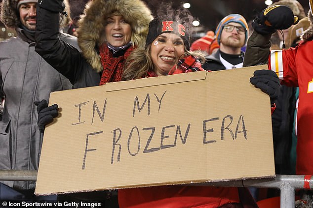 A Kansas City Chiefs fan holds a sign that says In My Frozen Era, in reference to Taylor Swift