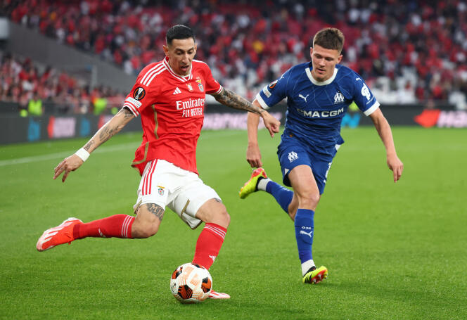 Benfica's Angel Di Maria in action with Olympique de Marseille's Quentin Merlin.