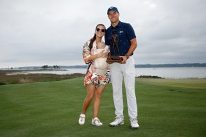 HILTON HEAD ISLAND, SOUTH CAROLINA - APRIL 17: Jordan Spieth poses with the trophy with wife Annie Verret and son Sammy Spieth after winning the RBC Heritage in a playoff at Harbor Town Golf Links on April 17, 2022 in Hilton Head Island, South Carolina. (Photo by Jared C. Tilton/Getty Images)