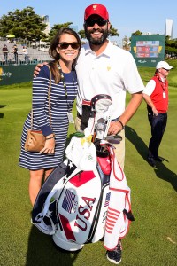 INCHEON CITY, SOUTH KOREA - OCTOBER 08: Annie Verret, girlfriend of Jordan Spieth of Team USA, and Spieth's caddie Michael Greller pose for a photo during the first round of The Presidents Cup at Jack Nicklaus Golf Club Korea on October 8, 2015 in Songdo IBD, Incheon City, South Korea. (Photo by Chris Condon/PGA TOUR)