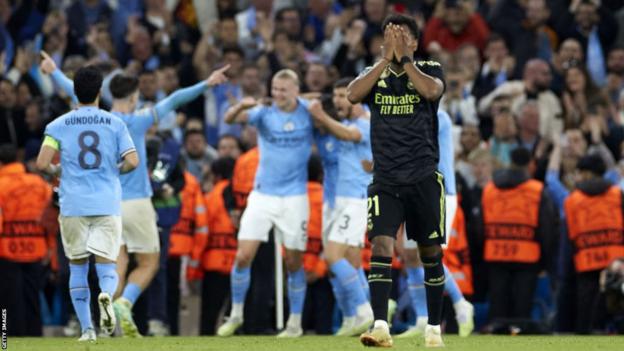 Real Madrid players look dejected after losing 4-0 at Manchester City in 2023