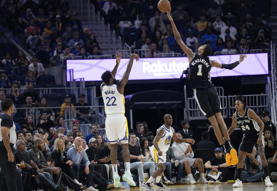 SAN FRANCISCO, CALIFORNIA - OCTOBER 20: Victor Wembanyama #1 of the San Antonio Spurs blocks the shot of Andrew Wiggins #22 of the Golden State Warriors during the first half of an NBA basketball game at Chase Center on October 20, 2023 in San Francisco, California. NOTE TO USER: User expressly acknowledges and agrees that, by downloading and or using this photograph, User is consenting to the terms and conditions of the Getty Images License Agreement. (Photo by Thearon W. Henderson/Getty Images)