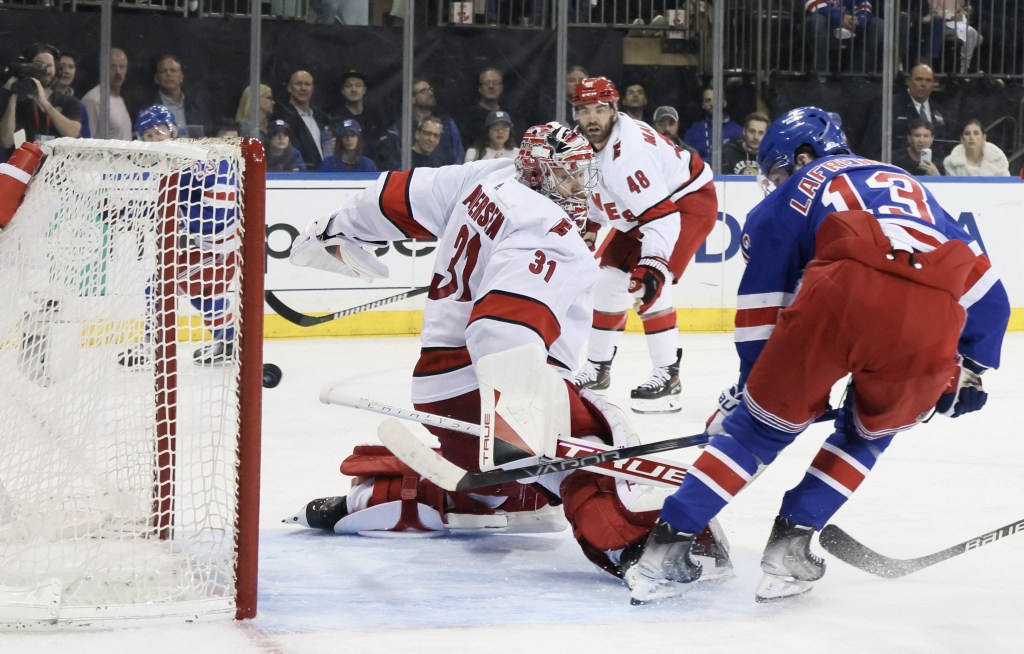 Alexis Lafreniere beats Frederik Andersen for the second of his two goals in the Rangers' Game 2 win over the Hurricanes.