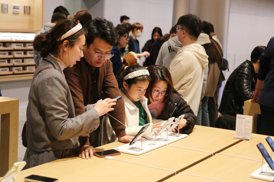 Customers are experiencing Apple's iPhone 15 series smartphones at the largest Apple flagship store in Asia in Shanghai, China, on March 23, 2024. (Photo by Costfoto/NurPhoto via Getty Images)