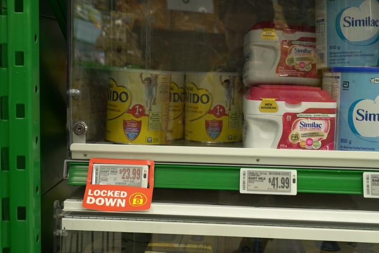 Baby formula being under lock and key as pictured here in a London Food Basics store, isn't new, according to one grocery store chain. Researcher Lesley Frank says it's becoming more prevalent outside of big cities, though.