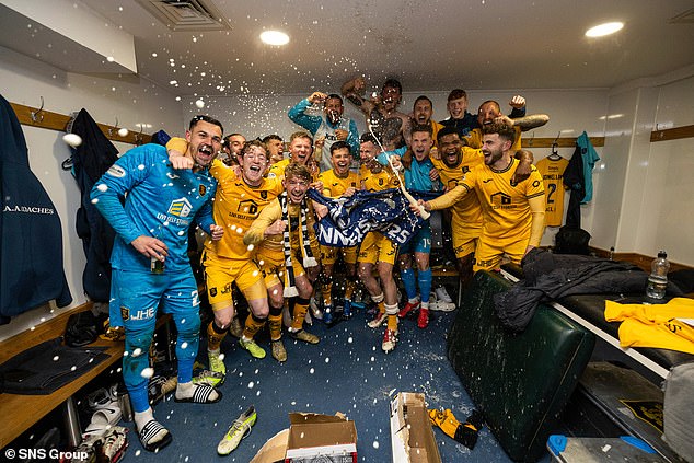 The triumphant Livingston players celebrate their remarkable play-off success in Dingwall